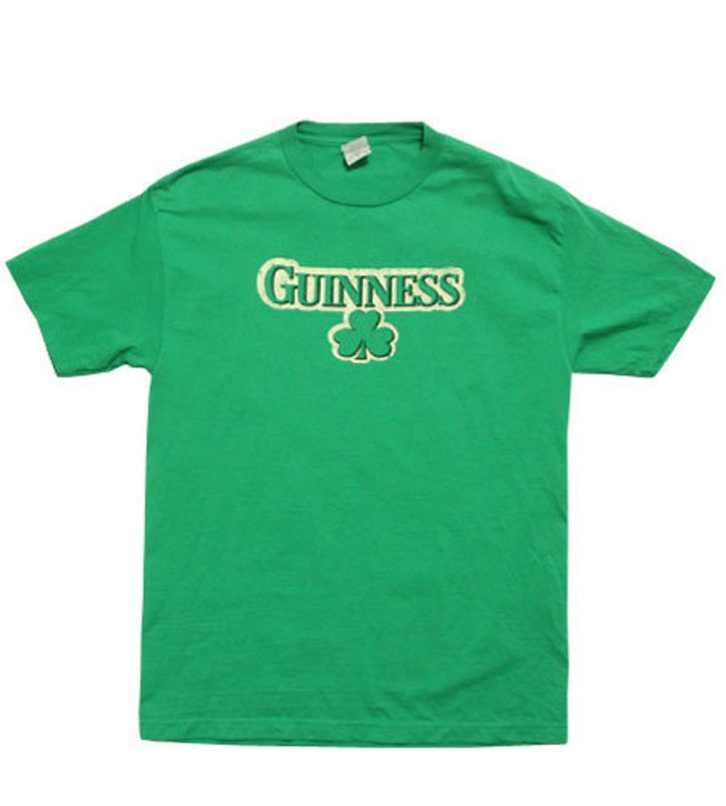 May include: Green t-shirt with a white "GUINNESS" logo and a green shamrock.