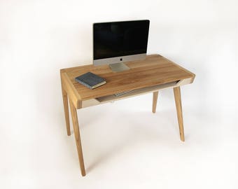 Solid oak wood desk with keyboard tray.