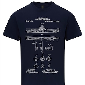 May include: A navy blue t-shirt featuring a white print of a patent drawing for a submersible torpedo boat. The drawing is titled "J.P. Holland. Submersible Torpedo Boat. Patented Apr. 12, 1892." and includes the patent number "No. 472,670."