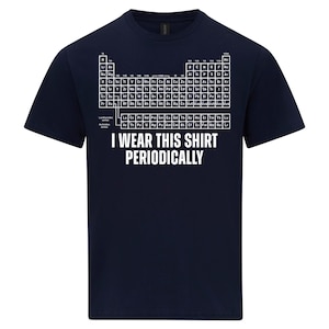 May include: Dark blue t-shirt with a white periodic table design and the text "I WEAR THIS SHIRT PERIODICALLY". A science-themed tee, perfect for chemistry lovers. The shirt is made of a soft material.