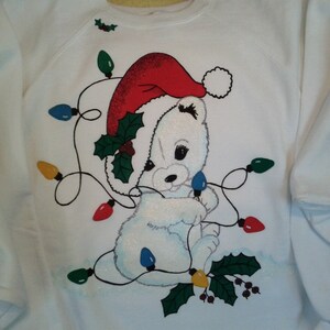 Tangled Christmas Polar Bear on Women's white hand-painted sweatshirt with Tri-Chem Liquid Embroidery. Machine wash, hang dry. image 1