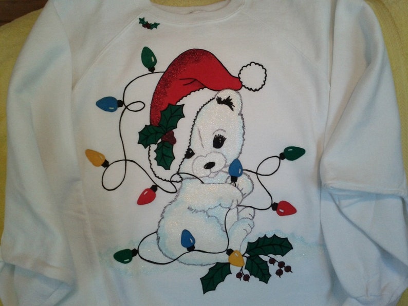 Tangled Christmas Polar Bear on Women's white hand-painted sweatshirt with Tri-Chem Liquid Embroidery. Machine wash, hang dry. image 1