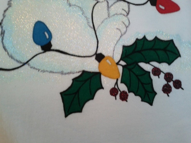 Tangled Christmas Polar Bear on Women's white hand-painted sweatshirt with Tri-Chem Liquid Embroidery. Machine wash, hang dry. image 2