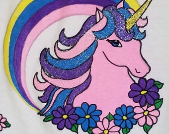 Pink Unicorn and Rainbow plus flowers shown on Girl's T-shirt or sweatshirt. Hand-painted with Tri-Chem Liquid Embroidery.Wash and dry