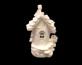 May include: White ceramic fairy house with a mushroom-shaped base, a door, and a roof made of leaves.