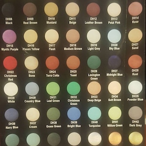 May include: A color chart with 55 acrylic paint colors, each color is labeled with a code and name. The colors are arranged in rows and columns. The chart is on a black background.