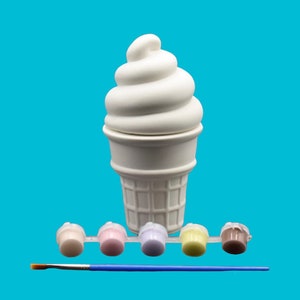 May include: White ceramic ice cream cone shaped container with a swirl of ice cream on top. The container is ready to be painted with the included set of five paint pots and a paintbrush.