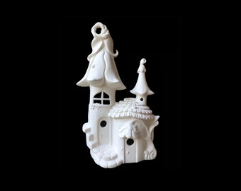 May include: White ceramic fairy house with a mushroom-shaped roof and a small door. The house has a whimsical design with a flower-shaped top and a small window.