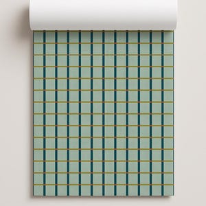 May include: A roll of wallpaper featuring a grid pattern on a light sage green background. The grid consists of vertical dark teal lines and horizontal mustard yellow lines that intersect to form a series of uniform squares across the surface.