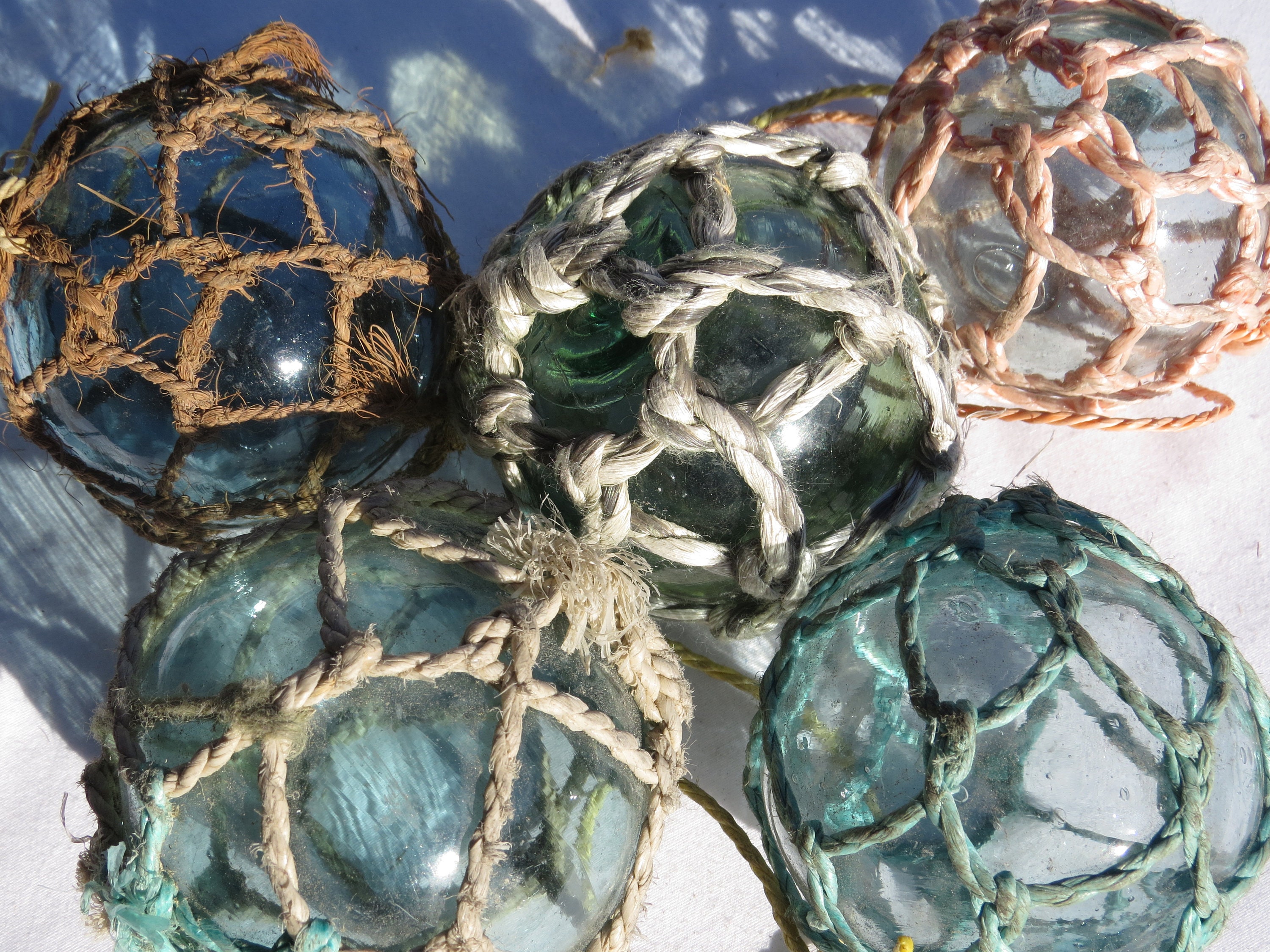 vintage glass fishing net floats, hand blown glass balls, blue green amber  amethyst colored glass