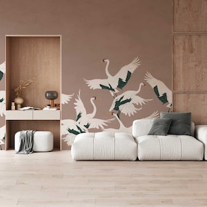 May include: A white sectional sofa with a light brown wood floor and a wall with a brown background and a pattern of white cranes with green accents.