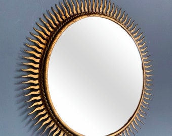 Sunburst gilt golden Mirror, steel and gold leaf finish. Mid century vintage 60s.