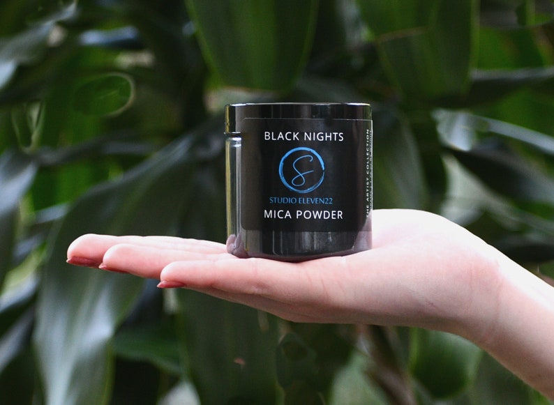 50 Gram Jar of Black Nights Mica held in a hand.