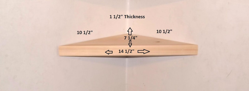 May include: A light-colored wooden corner shelf with dimensions labeled: 10 1/2 inches for the sides, 14 1/2 inches for the front edge, 7 1/4 inches for the depth, and 1 1/2 inches for the thickness, shown against a plain white background.