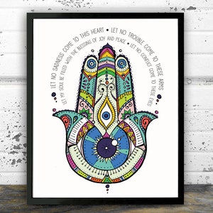 May include: A colorful Hamsa hand with a blue eye in the center. The Hamsa is surrounded by a decorative pattern and the text "Let no sadness come to this heart. Let no trouble come to these arms. Let my soul be filled with the blessing of joy and peace. Let no conflict come to these eyes."