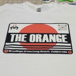 Camiseta Metal Gear Solid 2 La camiseta naranja inspirada en la caja de Sons of Liberty