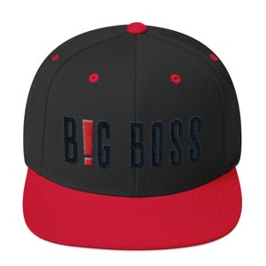 May include: Black and red baseball cap with the text "BIG BOSS" embroidered in blue and red.