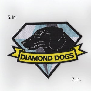 May include: A black and white diamond-shaped patch with a black dog's head and the text "DIAMOND DOGS" on a yellow banner.