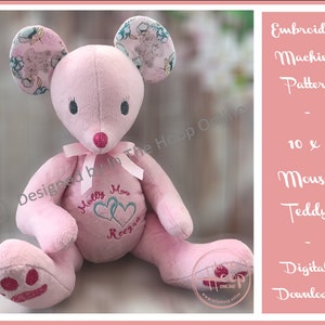 May include: Pink mouse teddy bear embroidery pattern for a 10x6 hoop. The pattern includes the text "Molly Moo Reegan" and two hearts.
