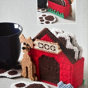May include: Set of four brown and white paw print coasters with a red and brown dog house shaped coaster holder. The holder has a brown dog and the word "DOG" on the front.