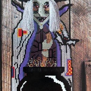 May include: A purple and white witch with a black hat and long white hair is stirring a black cauldron over a fire. The witch is holding a broom in her right hand and a bat is flying behind her. The background is a wooden wall.