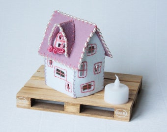 little embroidered house of felt, lighted house