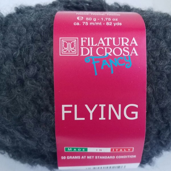 Flying by Filatura Di Crosa Fancy, A Soft boucle yarn that knits on US11  making it  great for quick fluffy knit scarves or trims on hats.