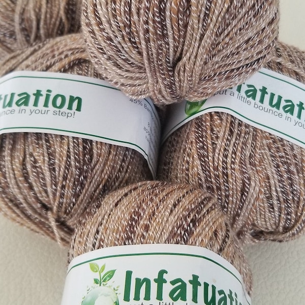 SWTC  Treisur Infatuation Sock Yarn. Bamboo, Wool and Nylon in Color # T306.  Soft and bouncy ball of yarn with approx.273 yds for 50 gr.