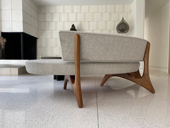 Floating curved sofa discount