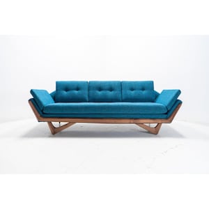 May include: A teal blue mid-century modern sofa with a wood frame and angled legs. The sofa has three cushions and is upholstered in a textured fabric.