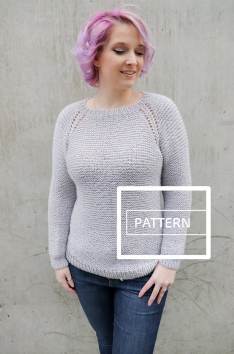 May include: A light gray knitted sweater with a round neckline and long sleeves. The sweater has a delicate lace pattern around the neckline and shoulders. The word "PATTERN" is written in white on a white rectangle in the lower right corner of the image.