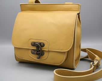 Hunter crossbody genuine leather bag in pale yellow colour with clasp closer, hand crafted only one a available relaxed everyday bag
