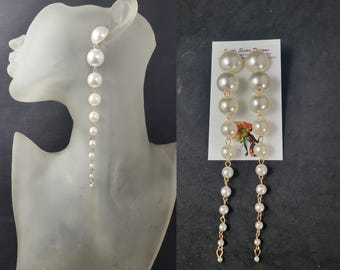 Hangoorbellen, lange oorbellen, pareloorbellen. Statementsieraden, statementoorbellen