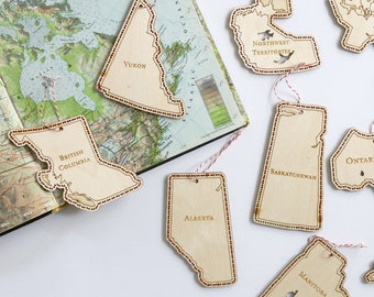 Complete set of laser cut hand stitched wood ornaments, provinces of Canada by Canadian Stitchery