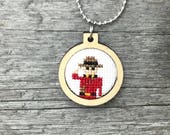 Constable Canada RCMP officer cross stitch necklace/pendant in laser cut wood frame (he's a Mountie!)