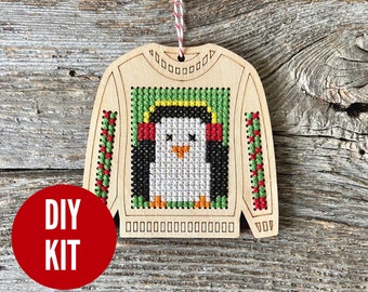 Pierre penguin wood ugly sweater cross stitch kit