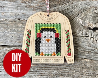 Pierre penguin wood ugly sweater cross stitch kit