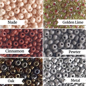 May include: Assortment of seed beads in various colors, including nude, golden lime, cinnamon, pewter, oak, and metal. The beads are small and round, and they are arranged in a grid pattern.