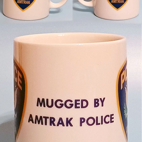 One > Authentic AMTRAK RAILROAD POLICE Ceramic Coffee Mug ~ Depicts Officers Uniform Patch & Phrase > Mugged By Amtrak Police