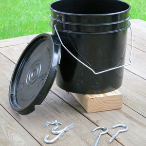 Hanging Bucket Poultry Nipple Waterer For Chickens, 1 Gallon, Black Includes Lid, Base, and Two Pairs of Hooks image 1