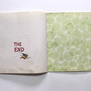 May include: The last page of a children's book with the words "THE END" in red text. A small cartoon mouse is flying with a string attached to its tail.