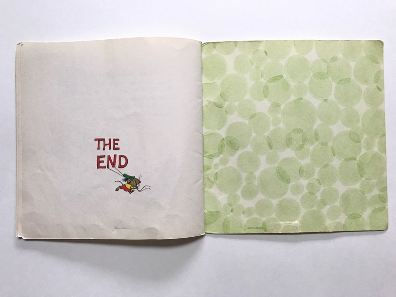May include: The last page of a children's book with the words "THE END" in red text. A small cartoon mouse is flying with a string attached to its tail.