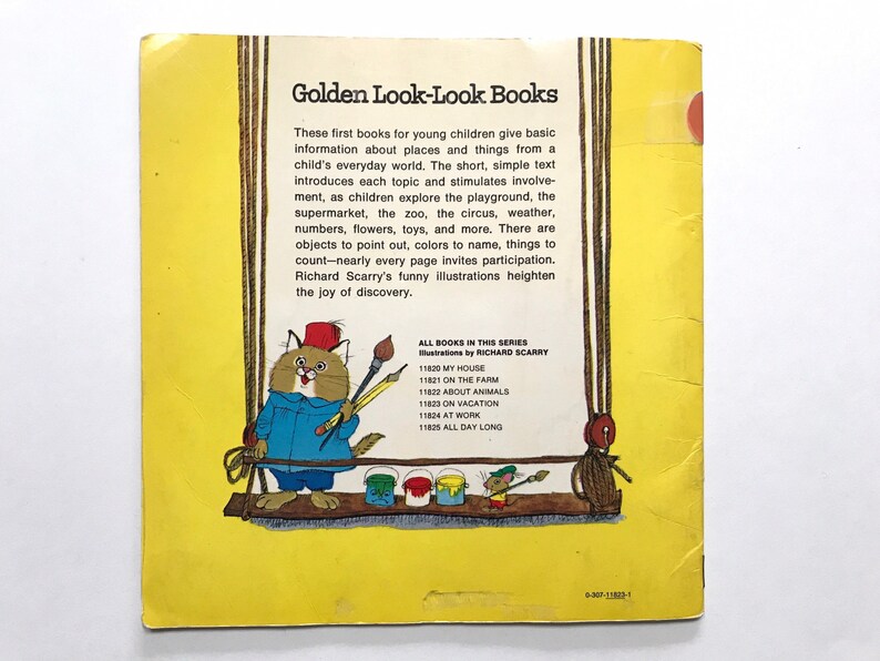 May include: A yellow book cover with a cat holding paintbrushes and a mouse on a swing. The book title is "Golden Look-Look Books" and the text describes the book series.