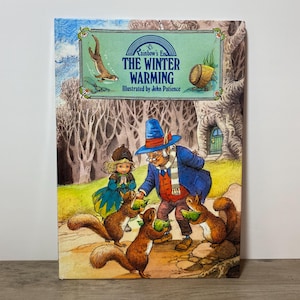 May include: A hardback book titled Rainbow's End The Winter Warming illustrated by John Patience. The cover features a colourful illustration of a person in a blue hat and coat interacting with three brown squirrels in a forest setting.