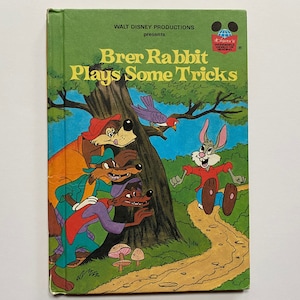 May include: A vintage children's book cover featuring a cartoon rabbit, a bird, and three foxes. The book title is "Brer Rabbit Plays Some Tricks" and is a Walt Disney Productions book.