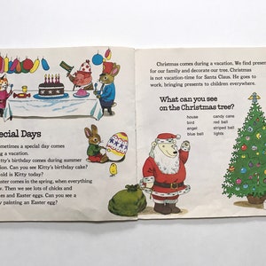 May include: An open book with illustrations of a birthday party, a bunny painting an Easter egg, and a polar bear dressed as Santa Claus standing next to a decorated Christmas tree. The text on the page reads "Special Days" and "What can you see on the Christmas tree?"
