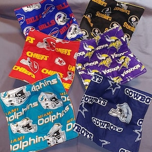 May include: Set of six colorful fabric pot holders featuring different NFL team logos, including the Bills, Chiefs, Vikings, Dolphins, Cowboys, and Steelers.