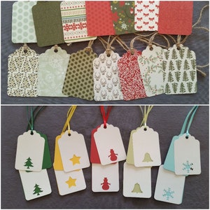 May include: A collection of decorative gift tags. The top row features tags with various patterns, including polka dots, snowflakes, and festive designs. The bottom row showcases tags with cut-out shapes like a Christmas tree, star, snowman, bell, and snowflake.