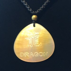 Abalone shell necklace with carved symbols