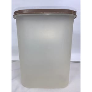 May include: A frosted plastic container with a brown lid. The container is rectangular with rounded corners and a slightly tapered shape. The lid is a solid brown color and fits snugly on top.